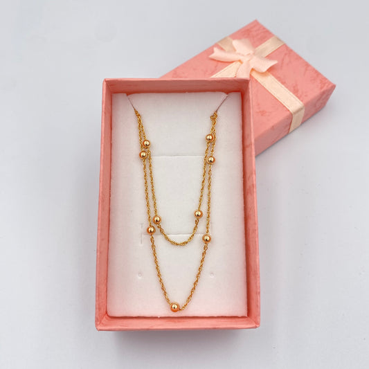 Collar dorado con esferas